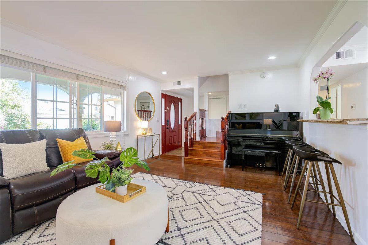 1224 Glacier Drive Milpitas, CA 95035 - Photo 4 of 45 a living room with furniture and a wooden floor