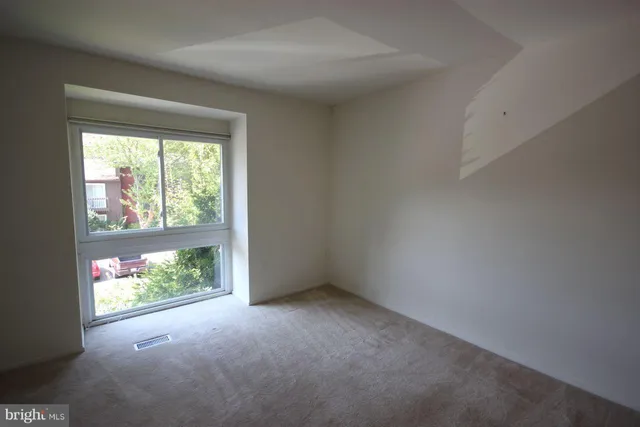 an empty room with windows