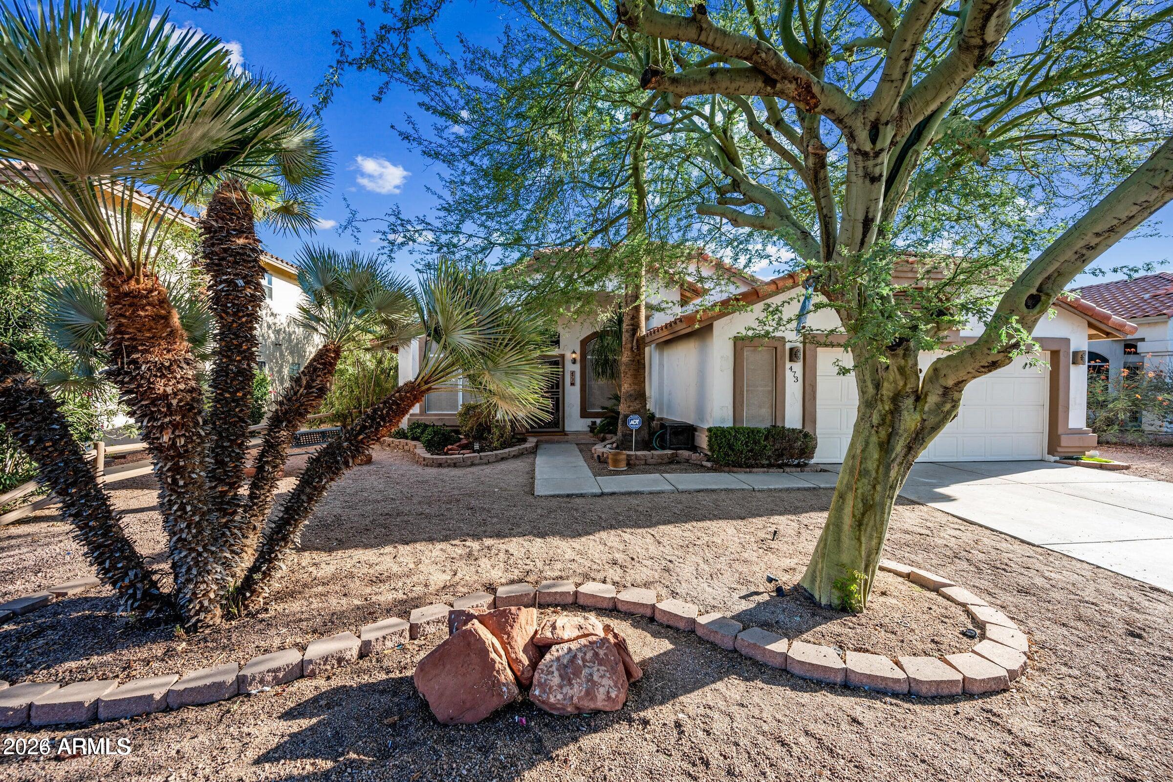 a view of a house with backyard