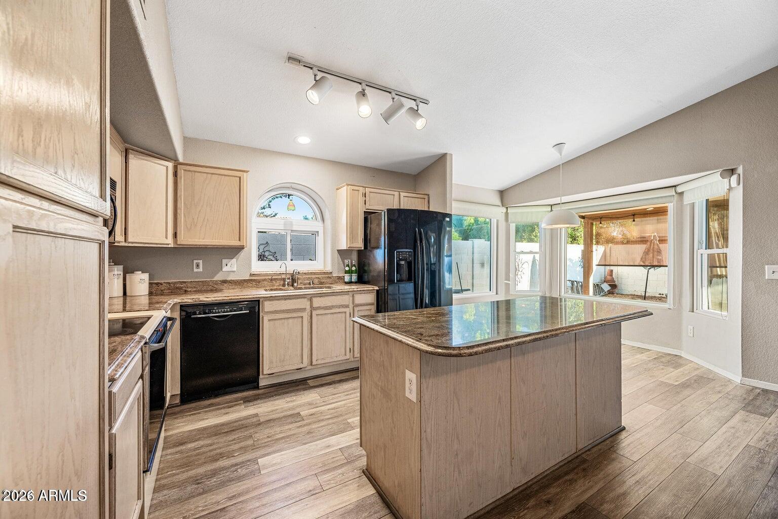 473 West Smoke Tree Road Gilbert, AZ 85233 - Photo 14 of 43 a kitchen with stainless steel appliances granite countertop a sink and a stove