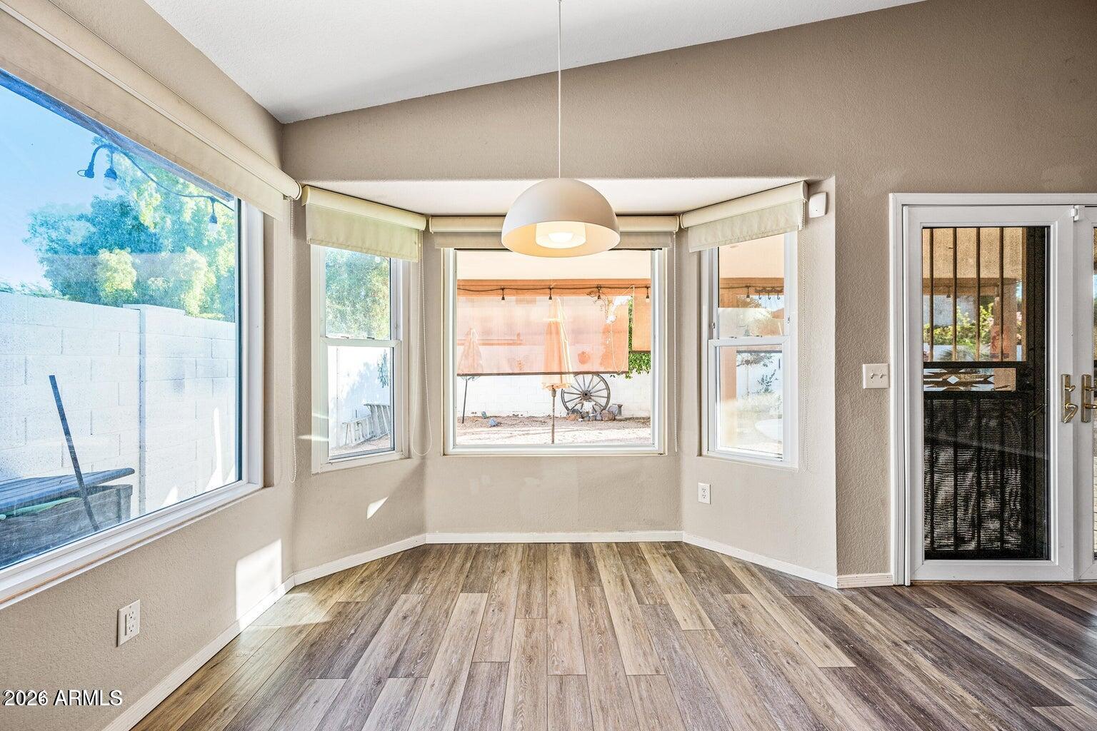 473 West Smoke Tree Road Gilbert, AZ 85233 - Photo 19 of 43 wooden floor in an empty room with a window