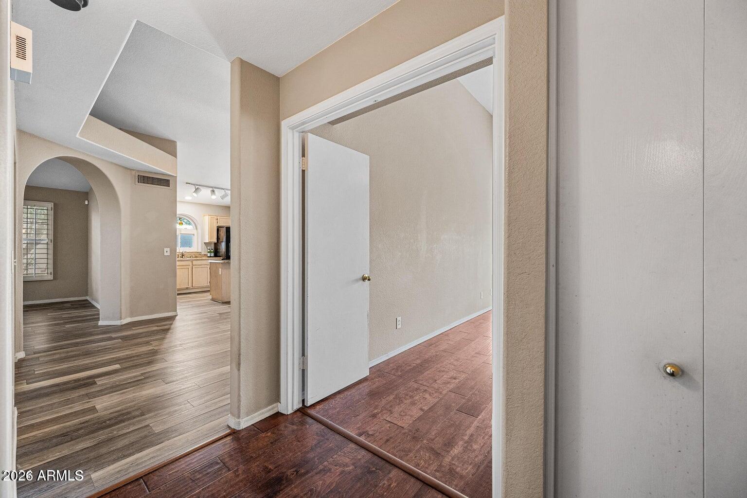 473 West Smoke Tree Road Gilbert, AZ 85233 - Photo 21 of 43 a view of a hallway with wooden floor