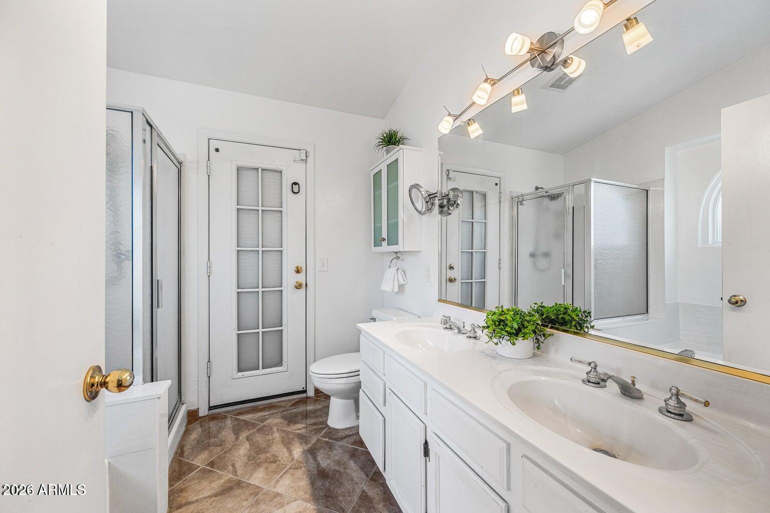 473 West Smoke Tree Road Gilbert, AZ 85233 - Photo 24 of 43 a bathroom with a sink a toilet and shower