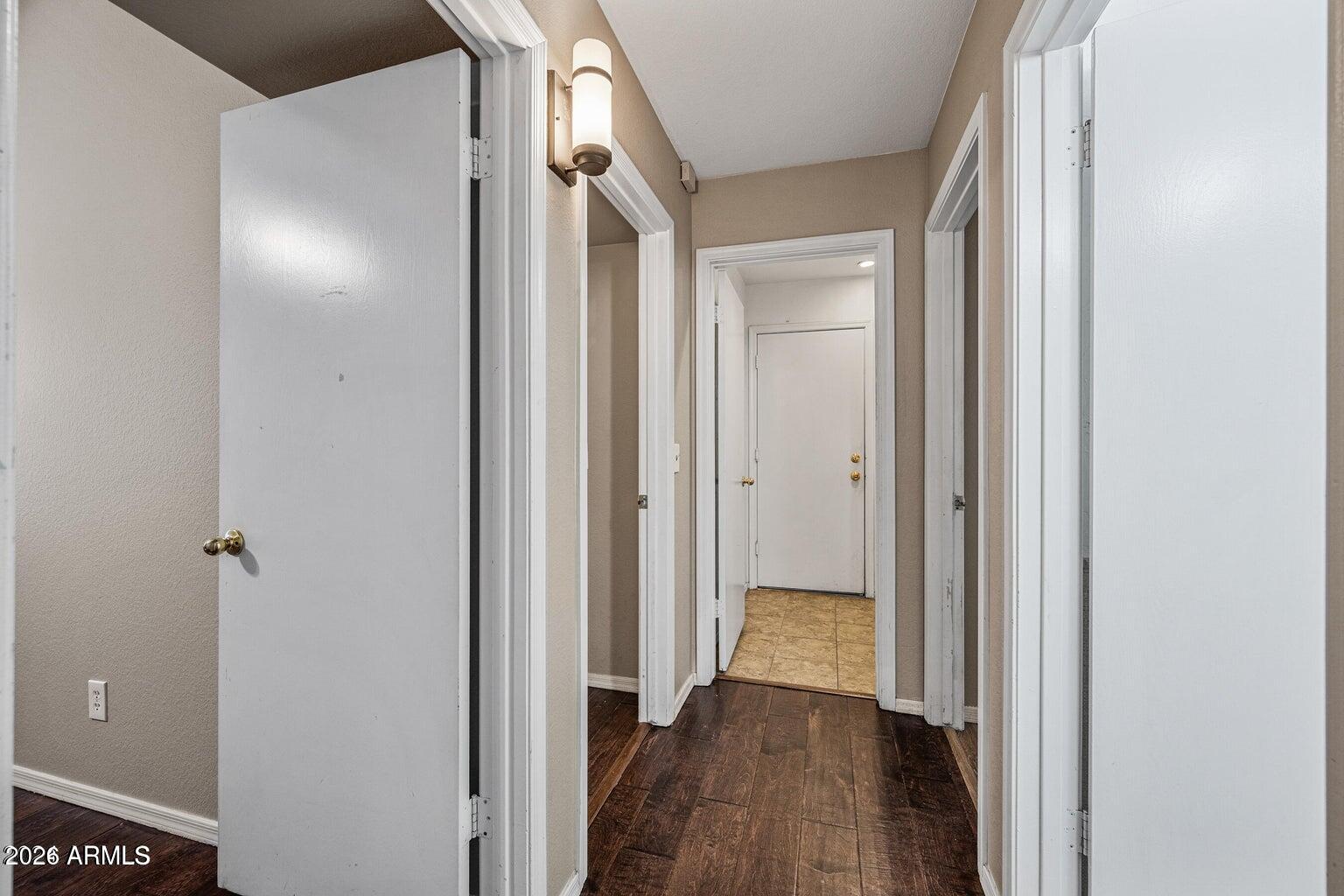 473 West Smoke Tree Road Gilbert, AZ 85233 - Photo 28 of 43 a view of a hallway with wooden floor