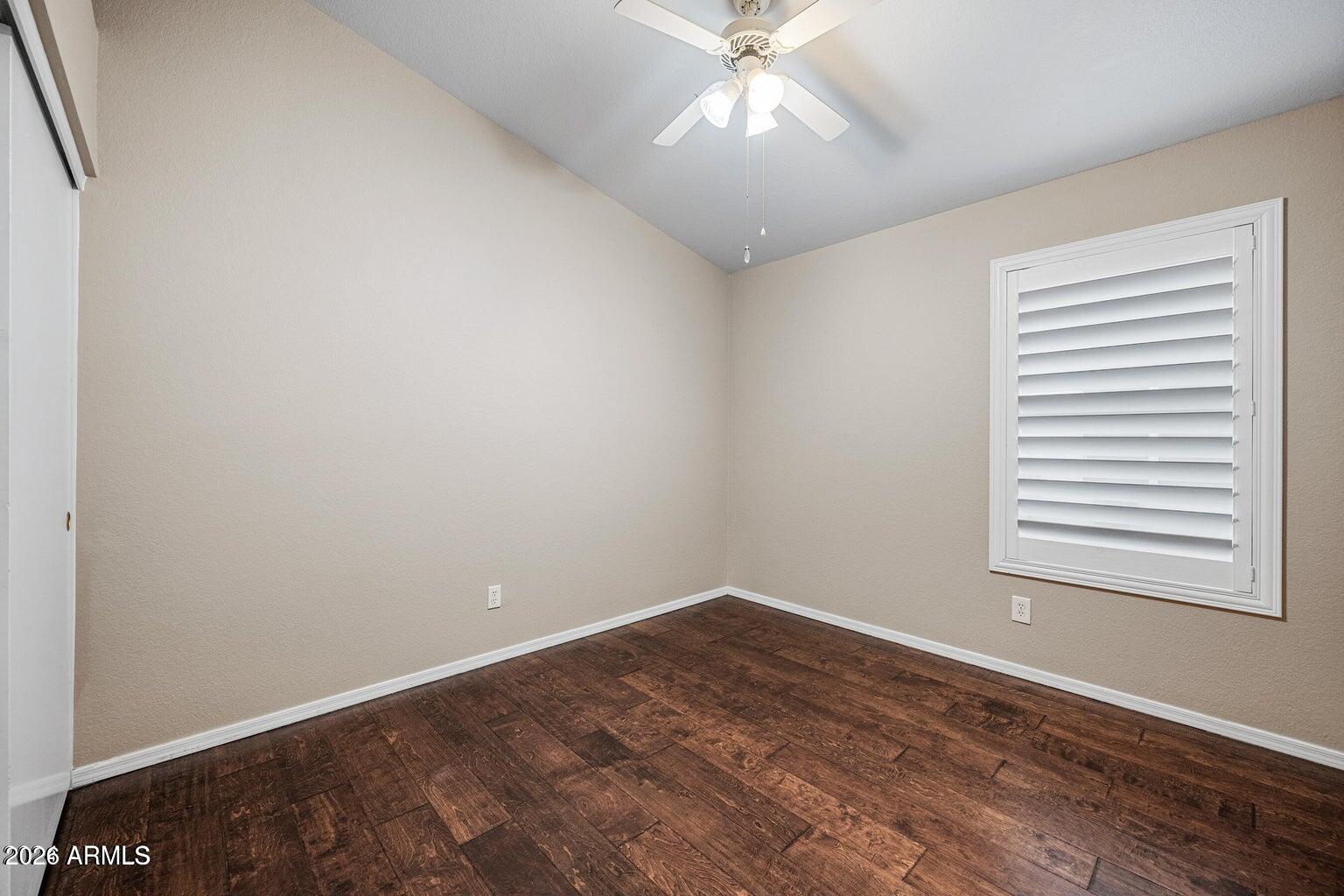 473 West Smoke Tree Road Gilbert, AZ 85233 - Photo 29 of 43 wooden floor in an empty room with a window
