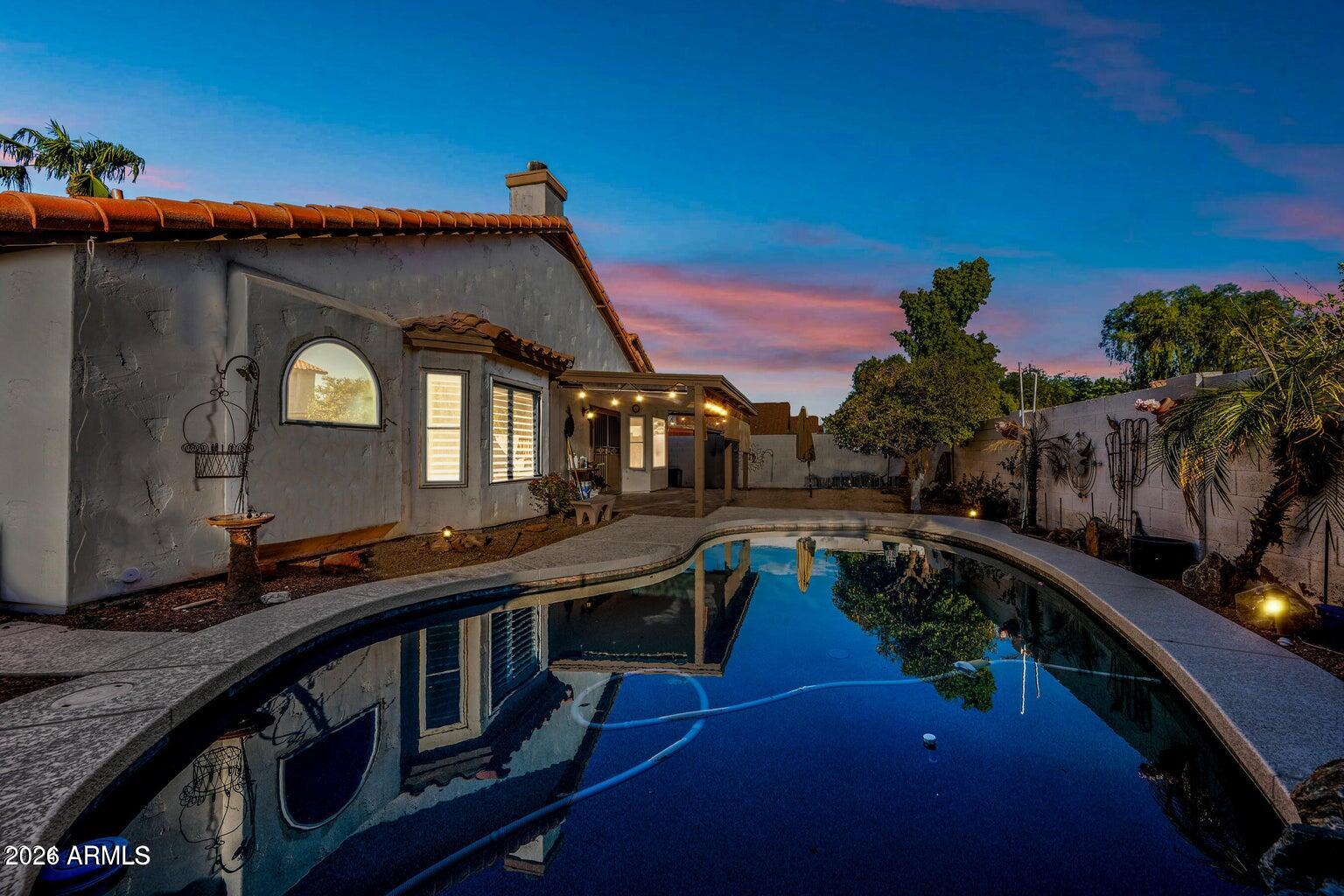 473 West Smoke Tree Road Gilbert, AZ 85233 - Photo 3 of 43 a view of a house with pool and furniture