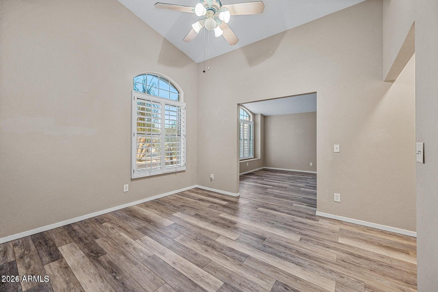 473 West Smoke Tree Road Gilbert, AZ 85233 - Photo 31 of 43 a view of an empty room with wooden floor and a window