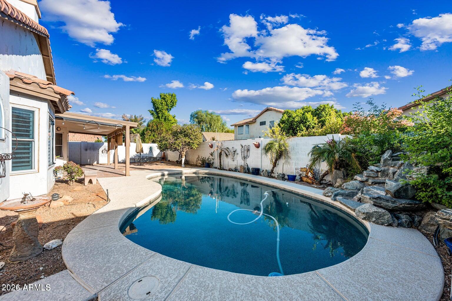 473 West Smoke Tree Road Gilbert, AZ 85233 - Photo 36 of 43 a view of a swimming pool with a yard