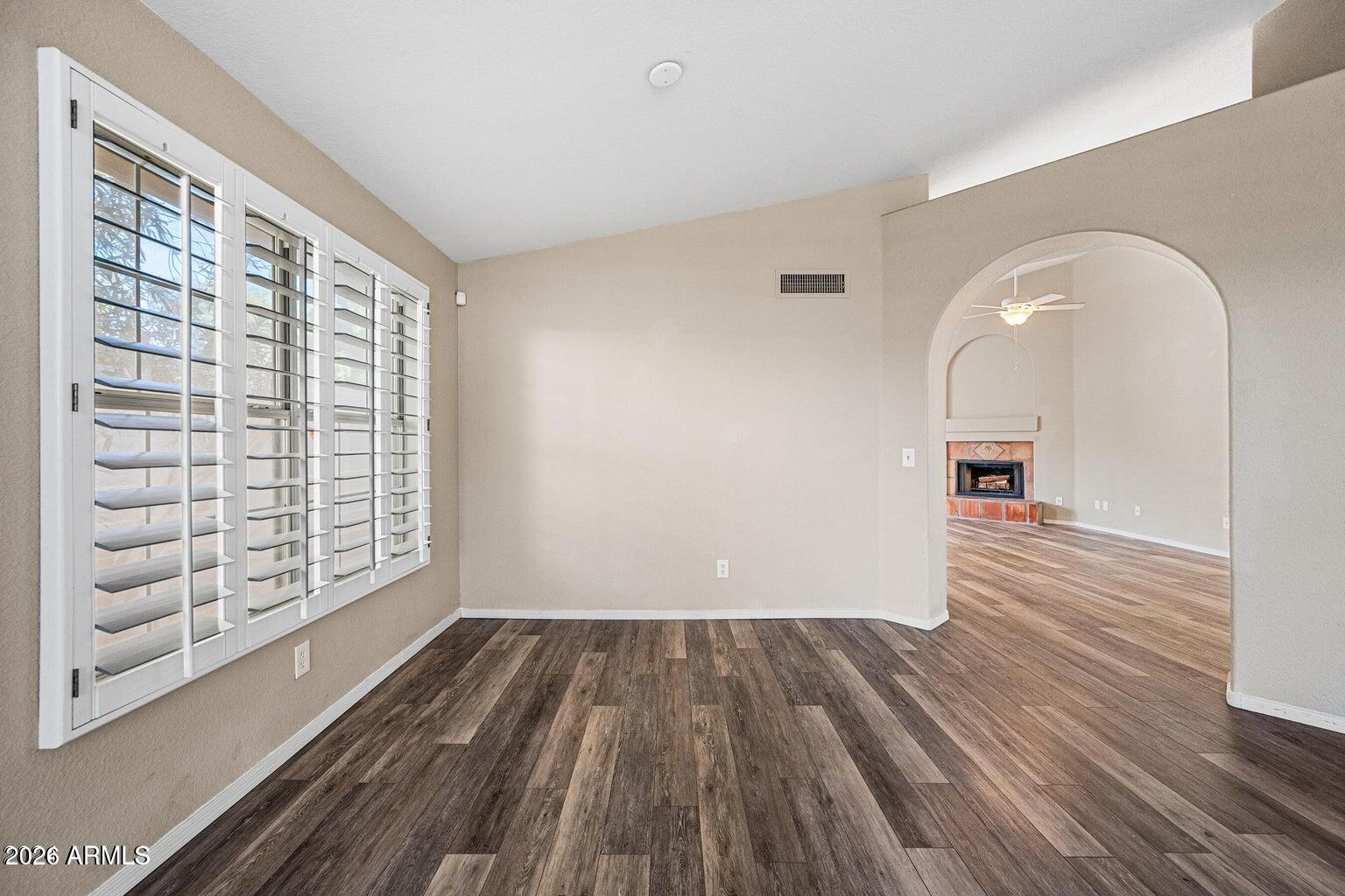473 West Smoke Tree Road Gilbert, AZ 85233 - Photo 8 of 43 wooden floor in an empty room with a window