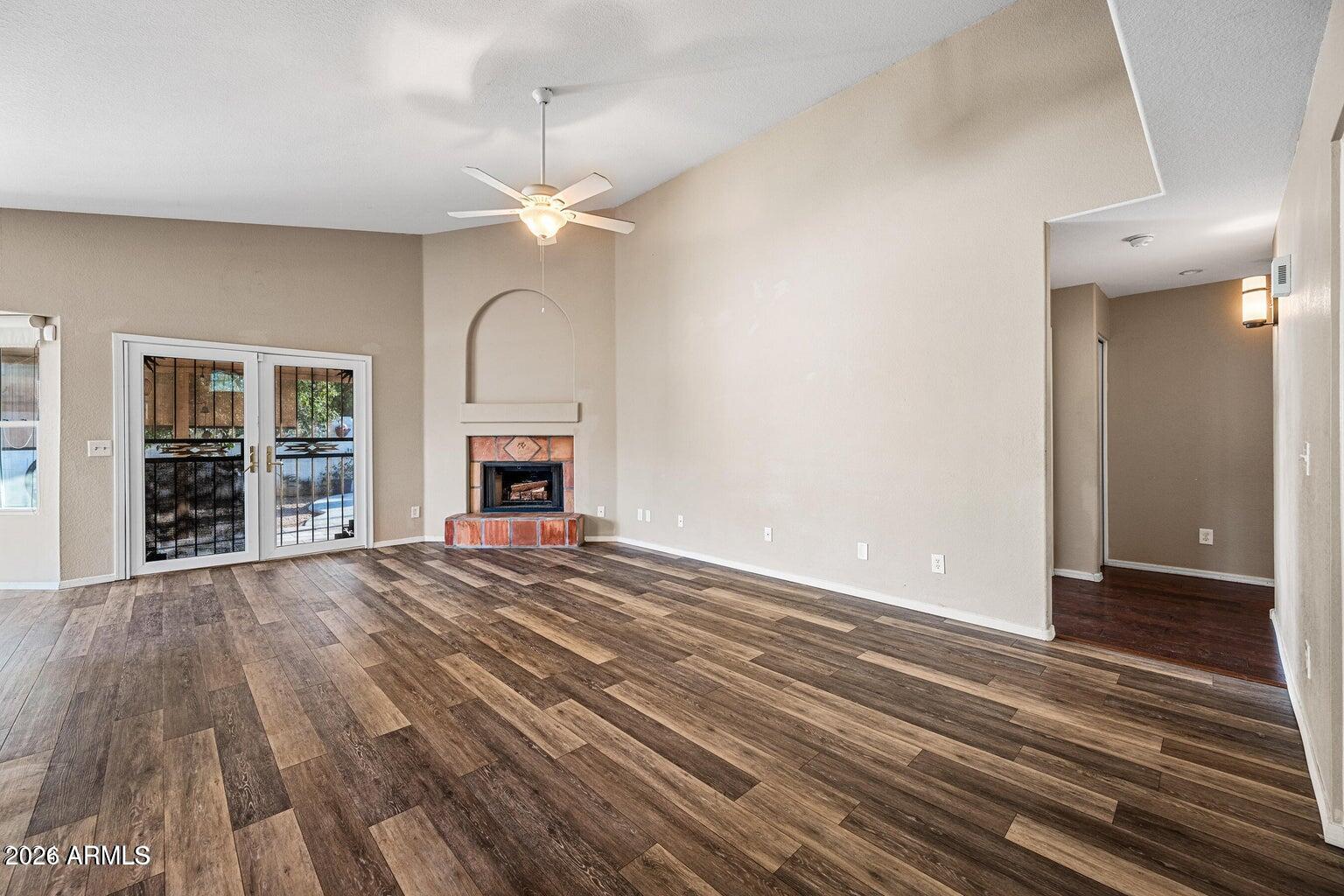 473 West Smoke Tree Road Gilbert, AZ 85233 - Photo 9 of 43 a view of an empty room with a fireplace and a window