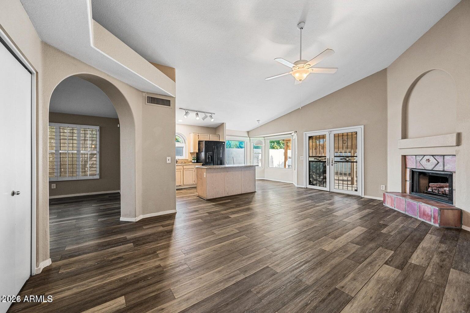 473 West Smoke Tree Road Gilbert, AZ 85233 - Photo 10 of 43 a view of a livingroom with wooden floor and a kitchen