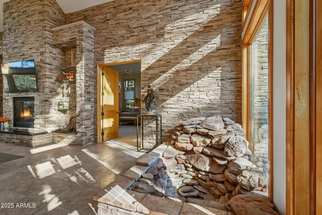 a large bathroom with a large window vanity and sink