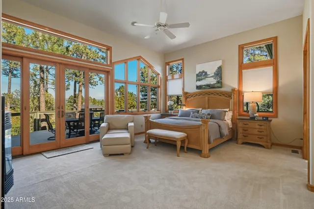 a bath tub sitting next to a large window
