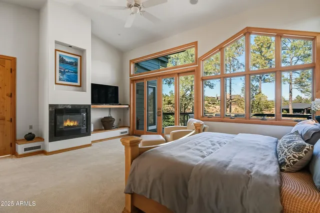 a view of walk in closet with clothes