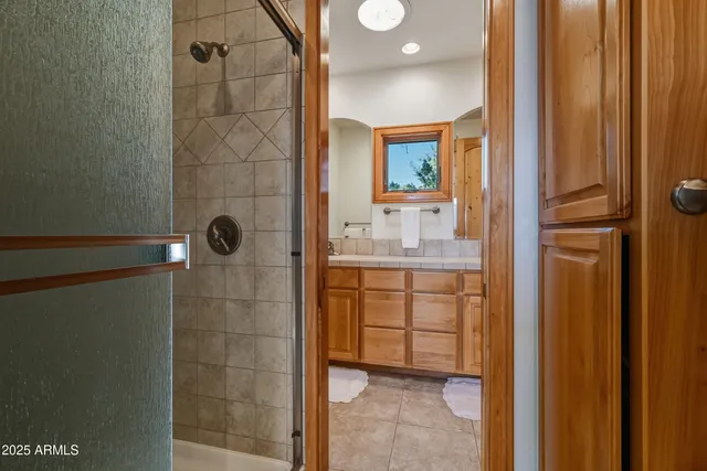 a spacious bedroom with a large bed and a window