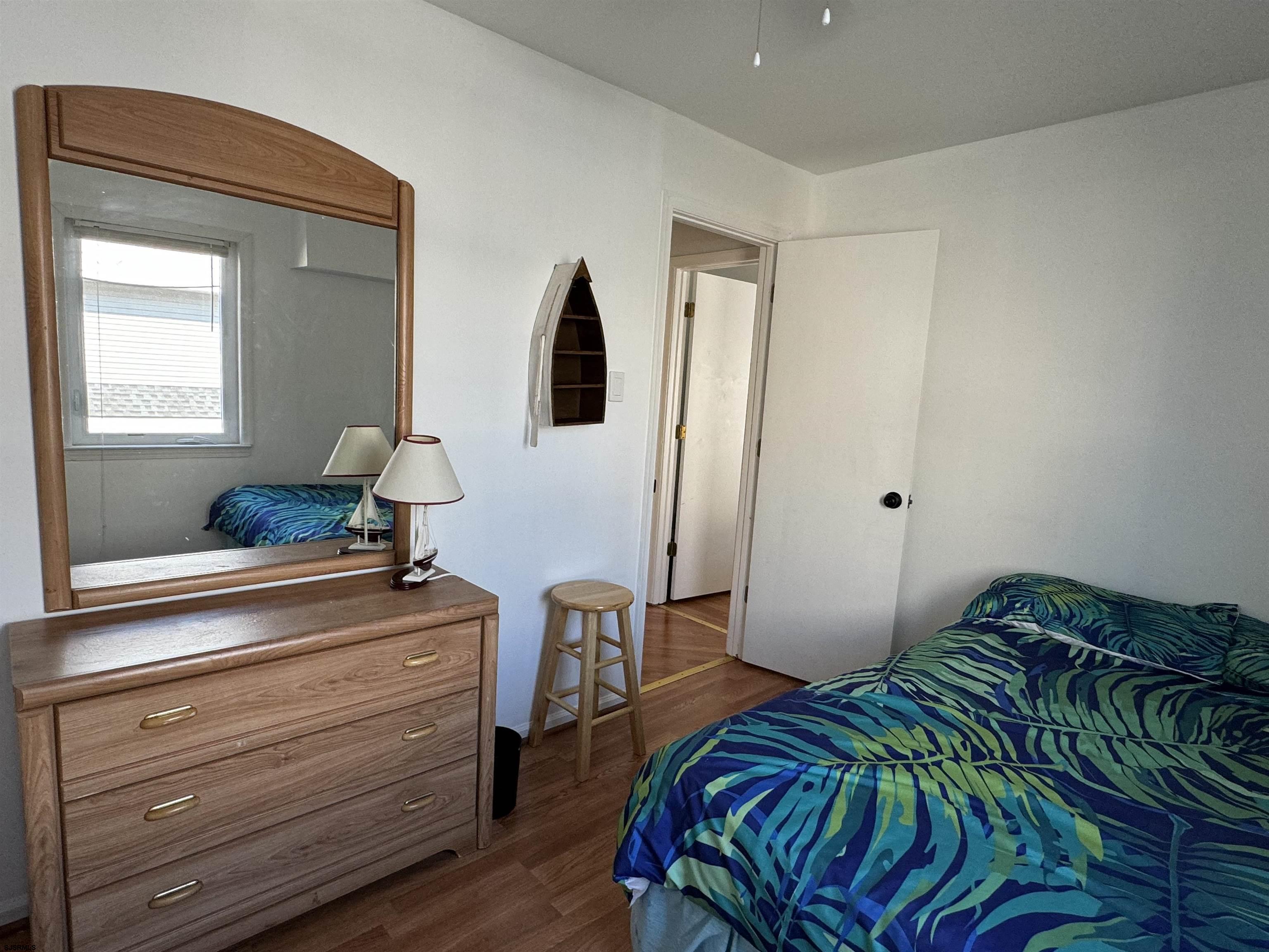 407 36th Street South, Unit 2 Brigantine, NJ 08203 - Photo 20 of 30 a bedroom with a bed and a dresser