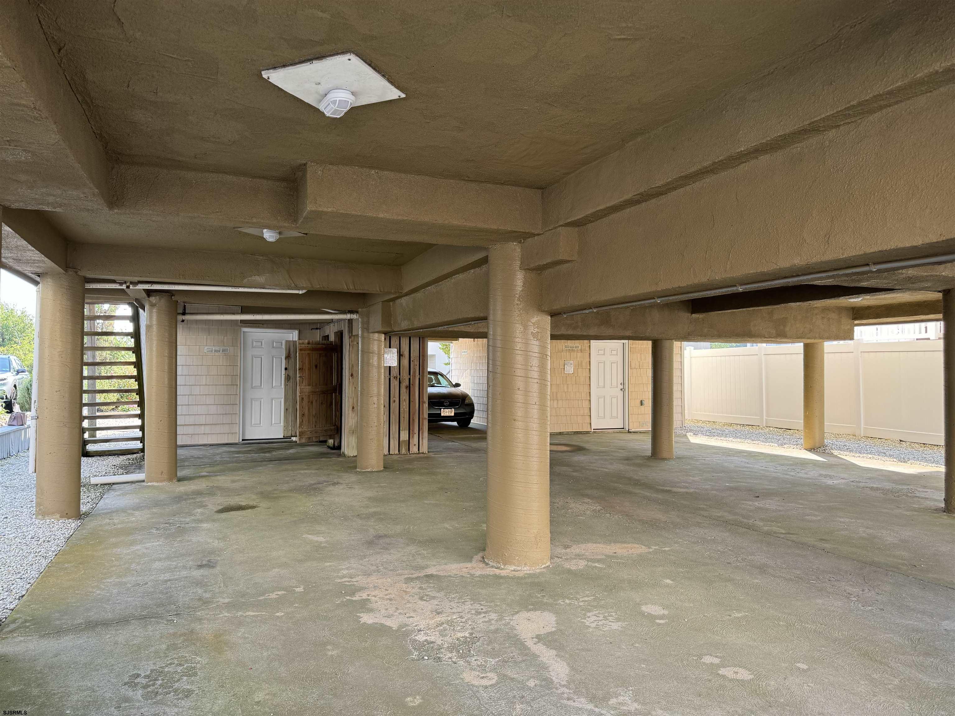 407 36th Street South, Unit 2 Brigantine, NJ 08203 - Photo 23 of 30 an empty room with windows and pillars in it