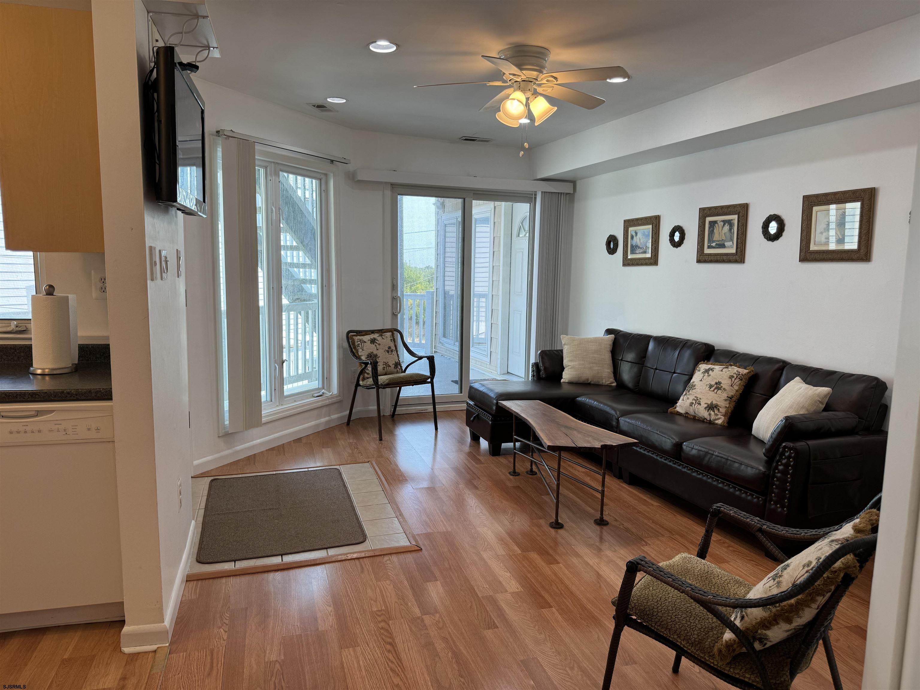 407 36th Street South, Unit 2 Brigantine, NJ 08203 - Photo 5 of 30 a living room with furniture and a wooden floor