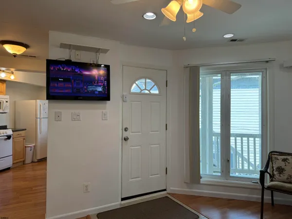 a view of a livingroom with furniture and windows