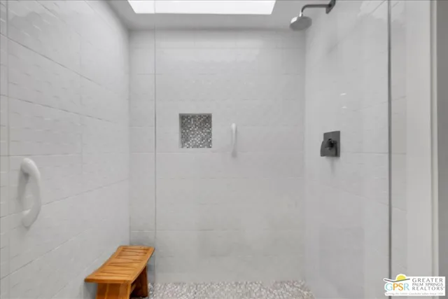 a bathroom with a shower and a toilet