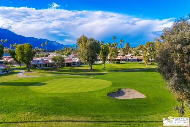 a view of a golf course with a garden