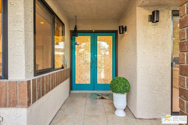 a view of a entryway door front of a house