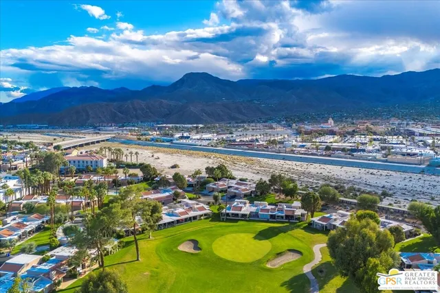 a view of a swimming pool with sitting area