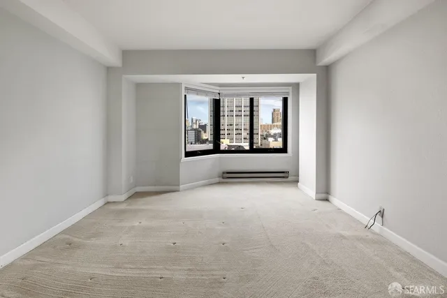 a view of an empty room with a window
