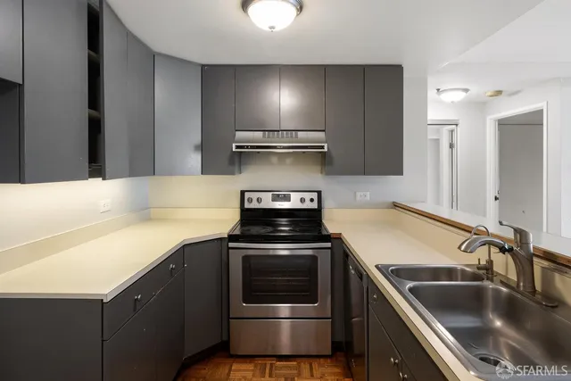 a kitchen with a stove and a sink