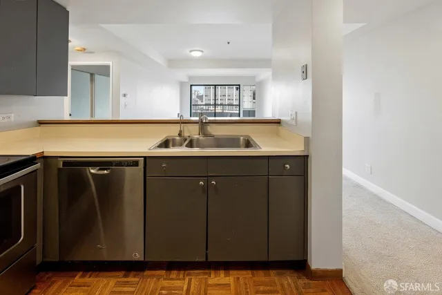 a kitchen with a sink and cabinets