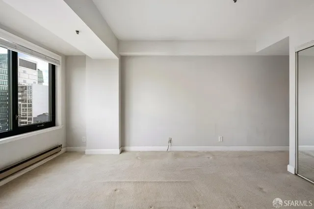 a view of an empty room with a window