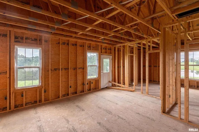 a view of an empty room with wooden walls