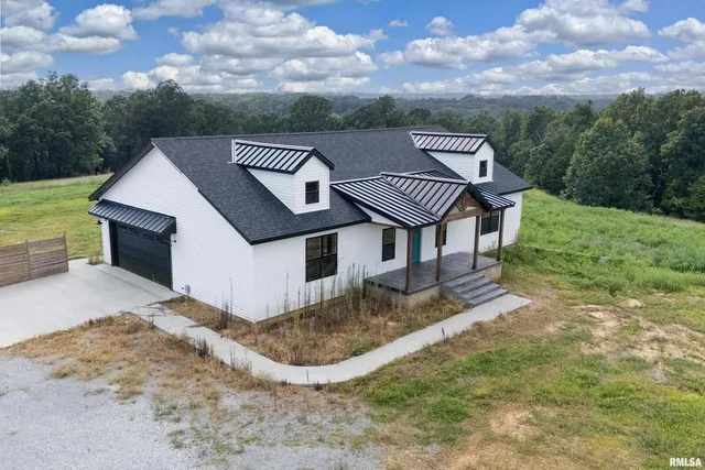 a view of a house with a big yard