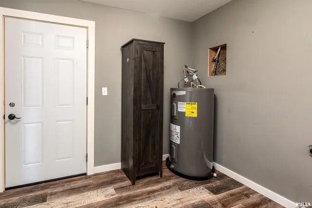 an aerial view of a house with garden space and a swimming pool