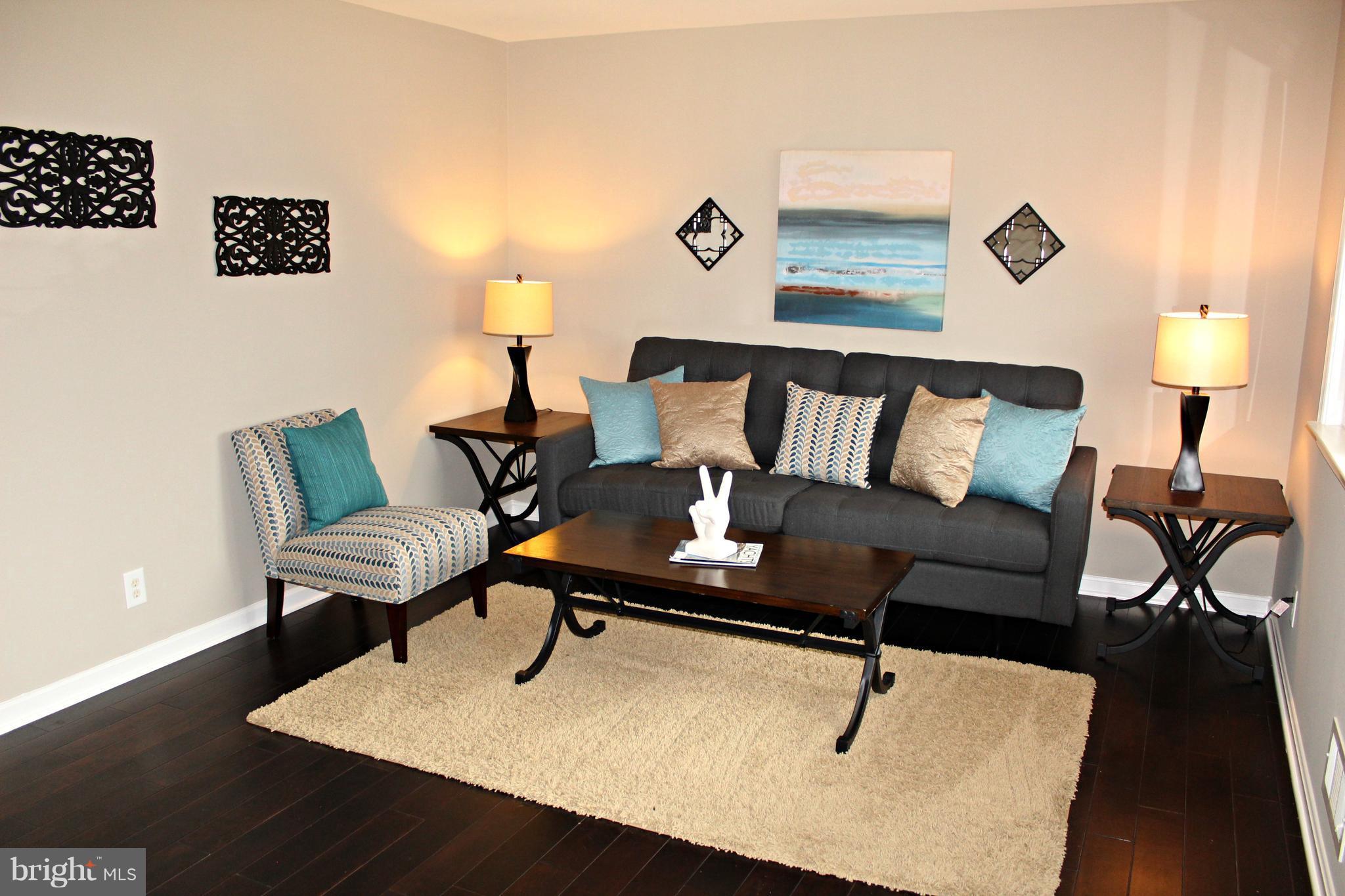 3707 Collier Road Randallstown, MD 21133 - Photo 10 of 29 Large, sunny living room with wood flooriing!