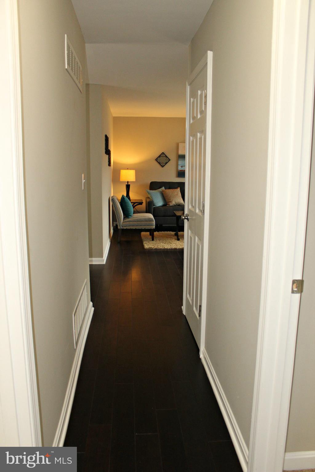 3707 Collier Road Randallstown, MD 21133 - Photo 17 of 29 Wood flooring in hall and living areas!