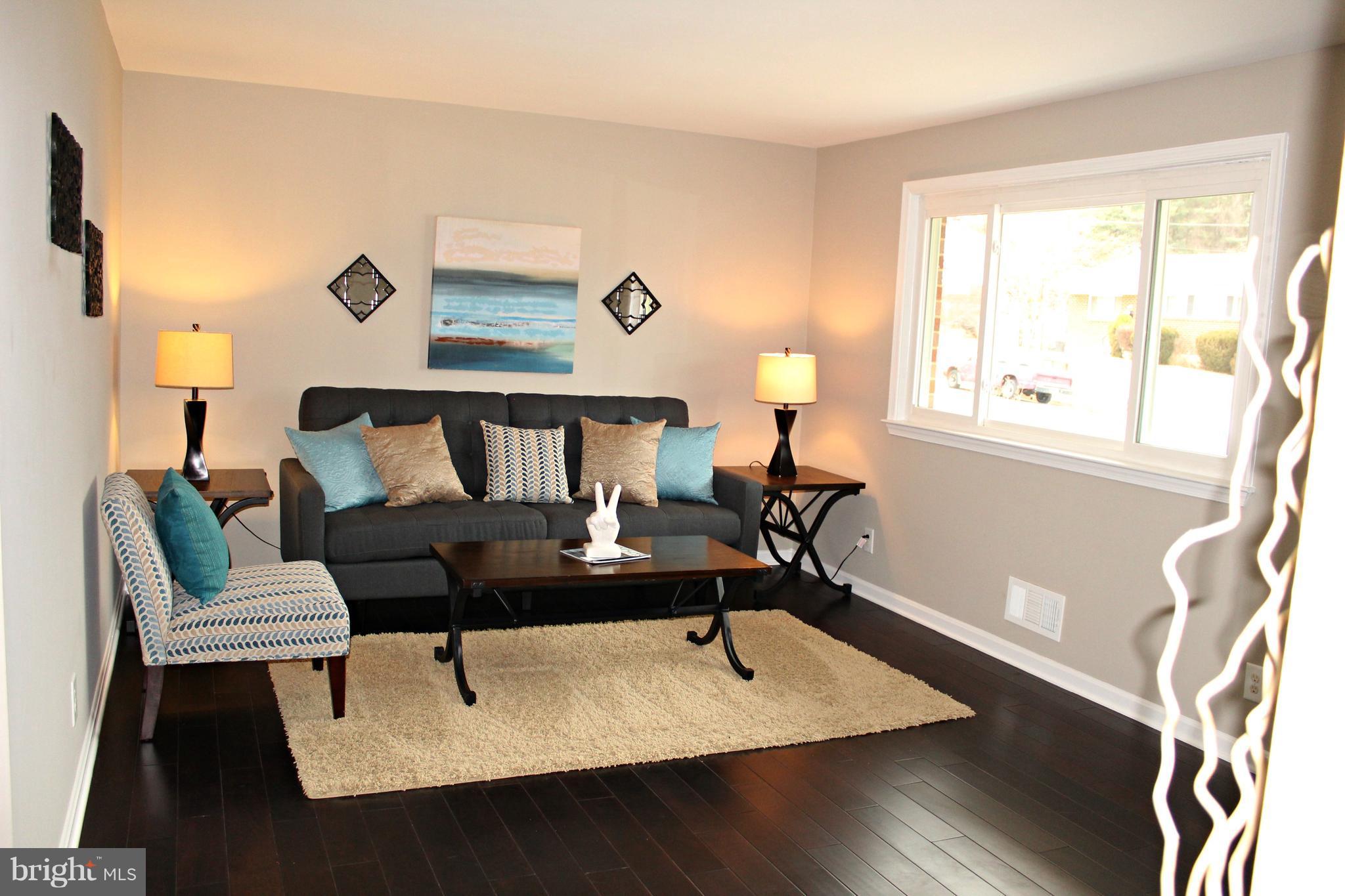 3707 Collier Road Randallstown, MD 21133 - Photo 3 of 29 Large, sunny living room with wood flooriing!