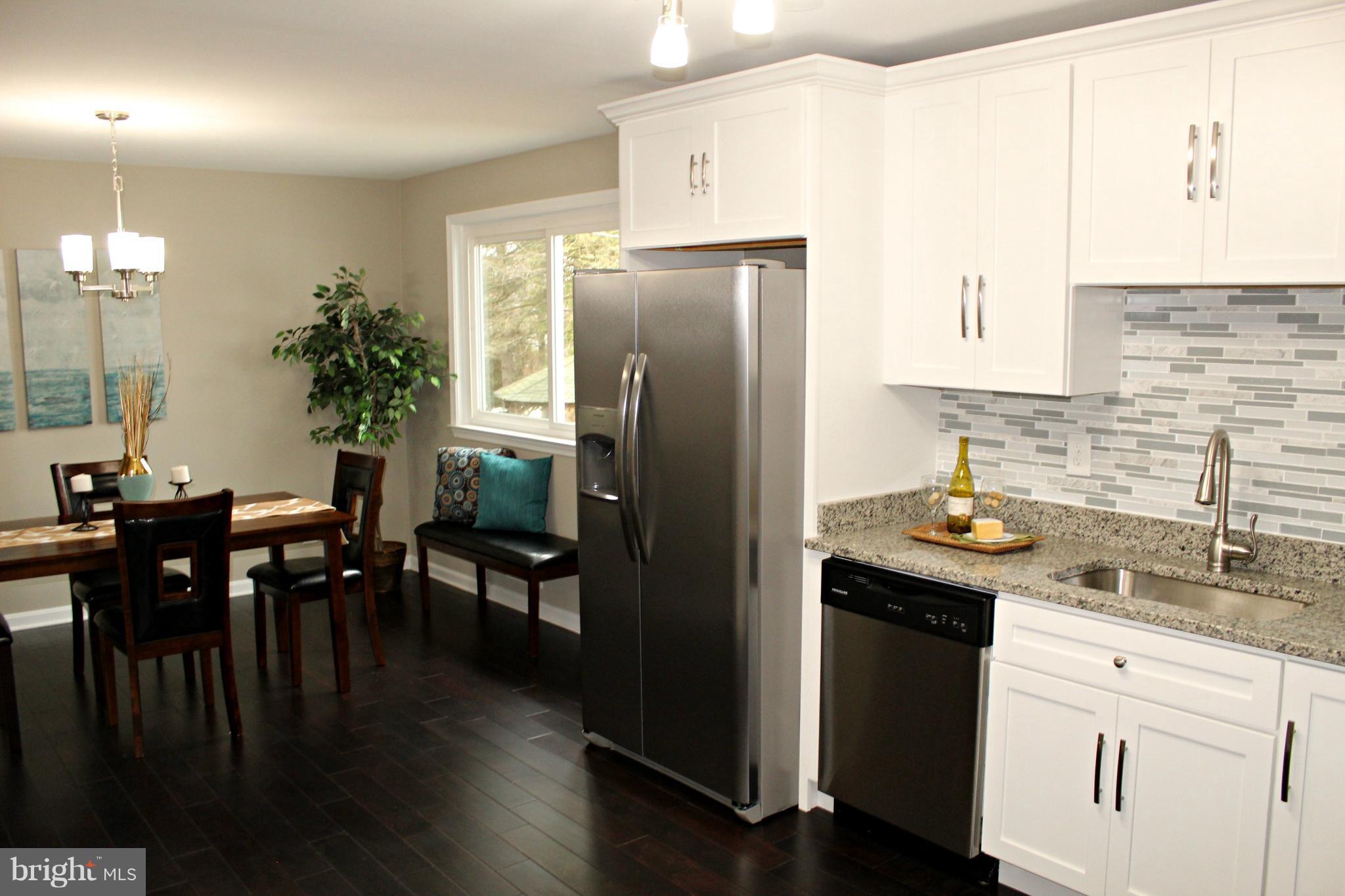 3707 Collier Road Randallstown, MD 21133 - Photo 8 of 29 Wood flooring in dining room & new kitchen!