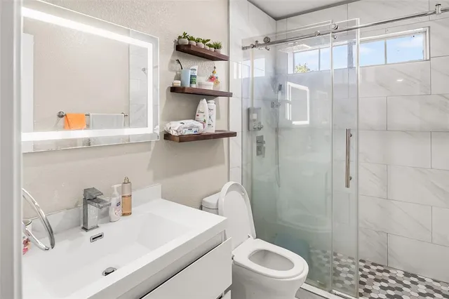 a bedroom with a bed and a cabinets