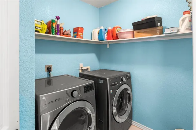 a view of a livingroom with furniture and stairs