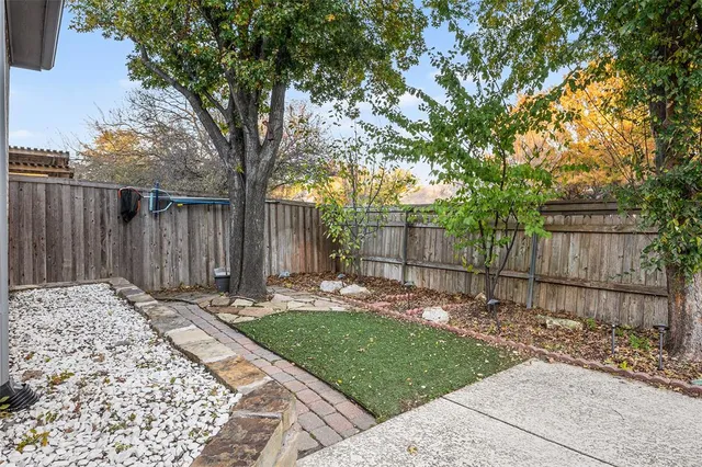 a view of a roof deck with wooden floor and fence