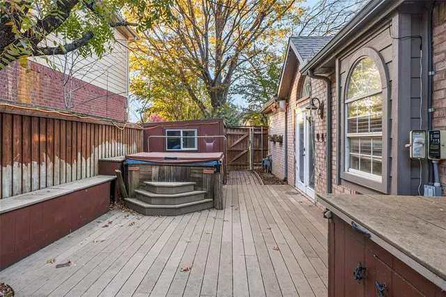a view of a house with a wooden floor and a large window