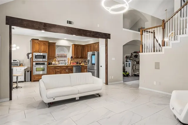 a living room with furniture and a table