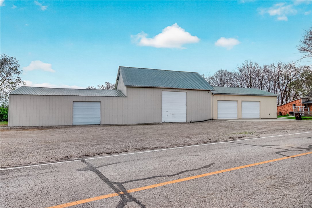 8700 Quaker Trace Road Camden, OH 45311 - Photo 28 of 34 This expansive commercial property features multiple garages, offering versatile space for various needs.