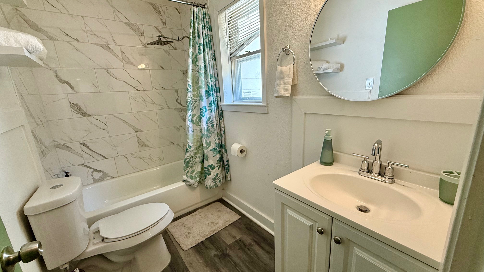 1802 East University Avenue, Unit A Georgetown, TX 78626 - Photo 18 of 23 Bathroom with vanity, shower / tub combo with curtain, and dark wood-style floors