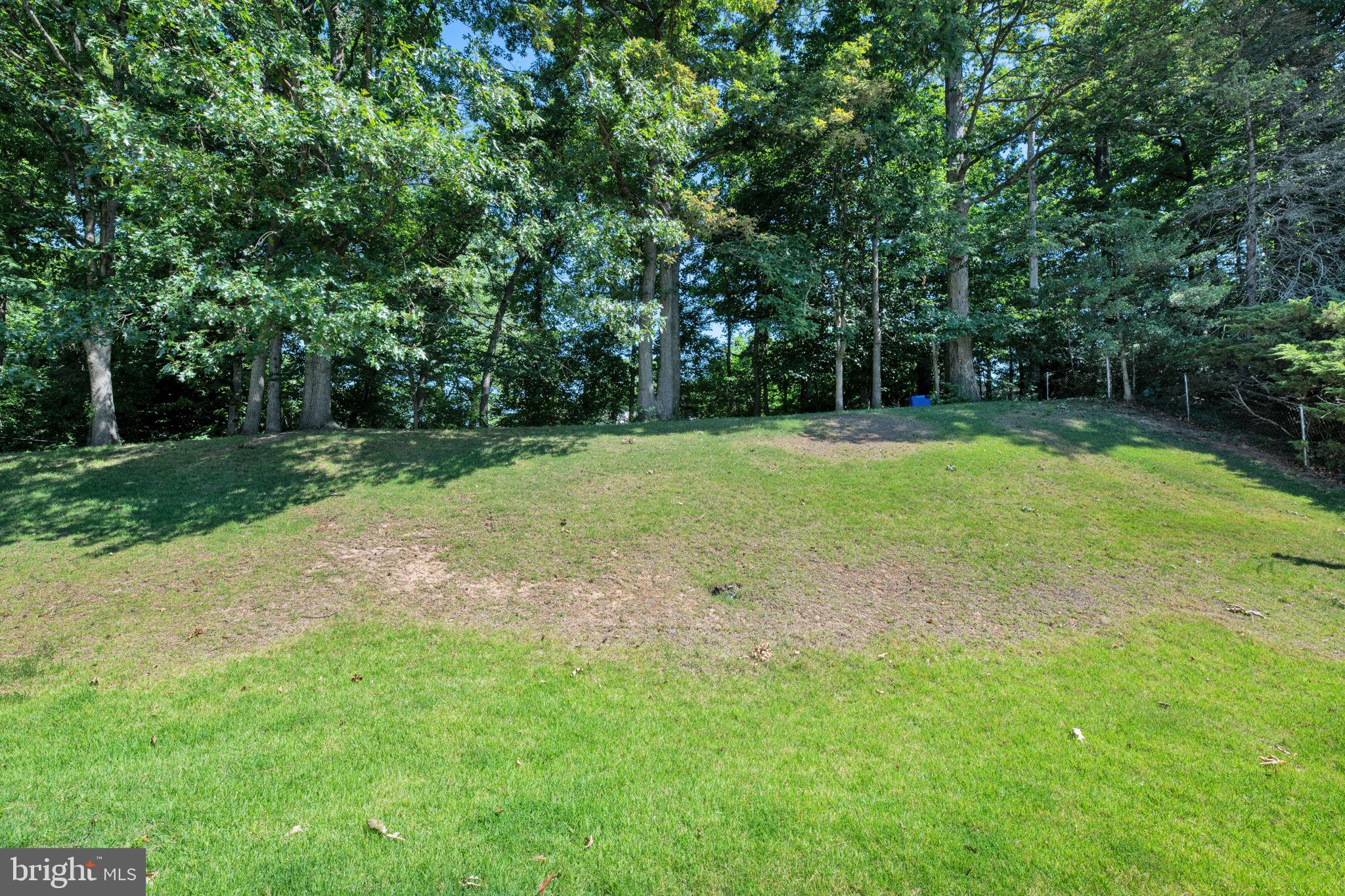 8812 Churchfield Lane Laurel, MD 20708 - Photo 24 of 31 a view of a field with trees in the background