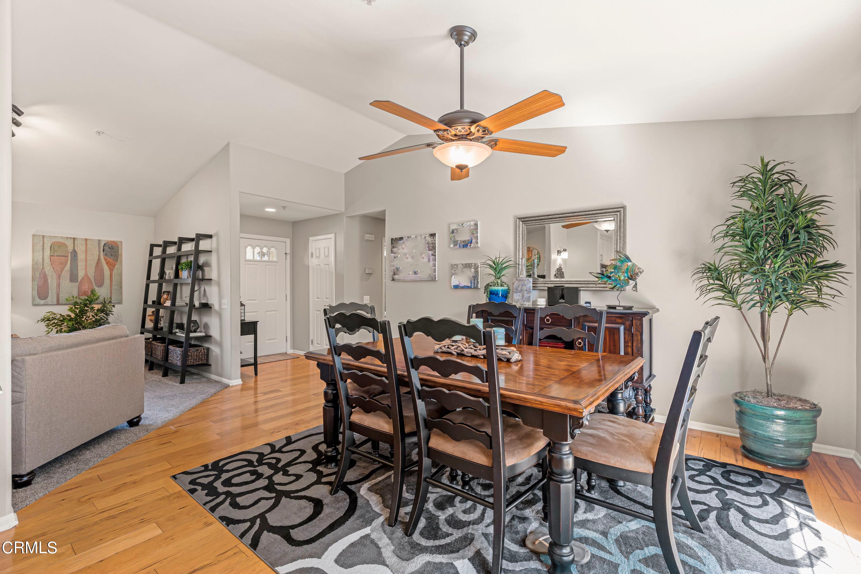 10975 Darling Road Ventura, CA 93004 - Photo 11 of 49 a view of a dining room and livingroom with furniture wooden floor a chandelier