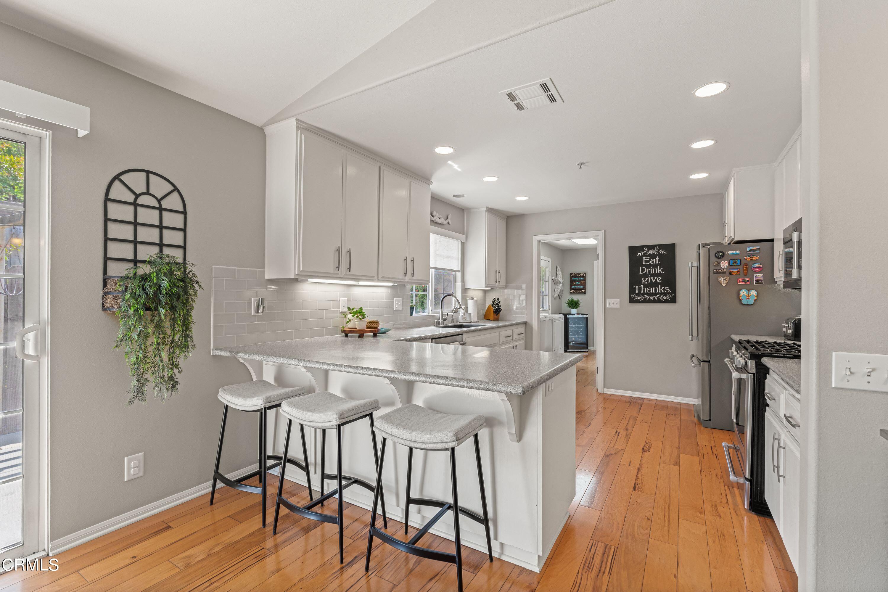 10975 Darling Road Ventura, CA 93004 - Photo 12 of 49 a view of a dining room with furniture and wooden floor