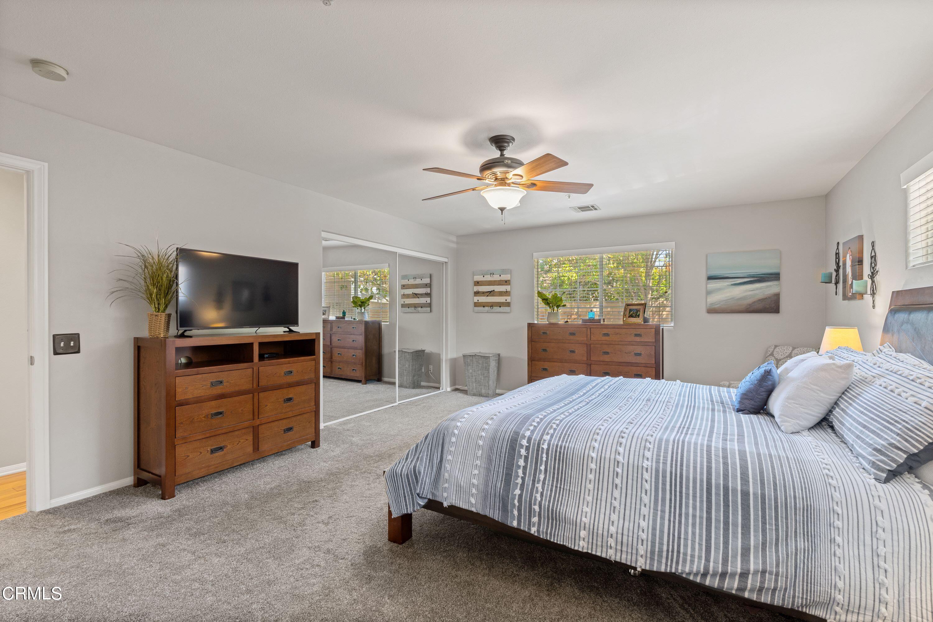 10975 Darling Road Ventura, CA 93004 - Photo 18 of 49 a bedroom with a bed and a flat screen tv