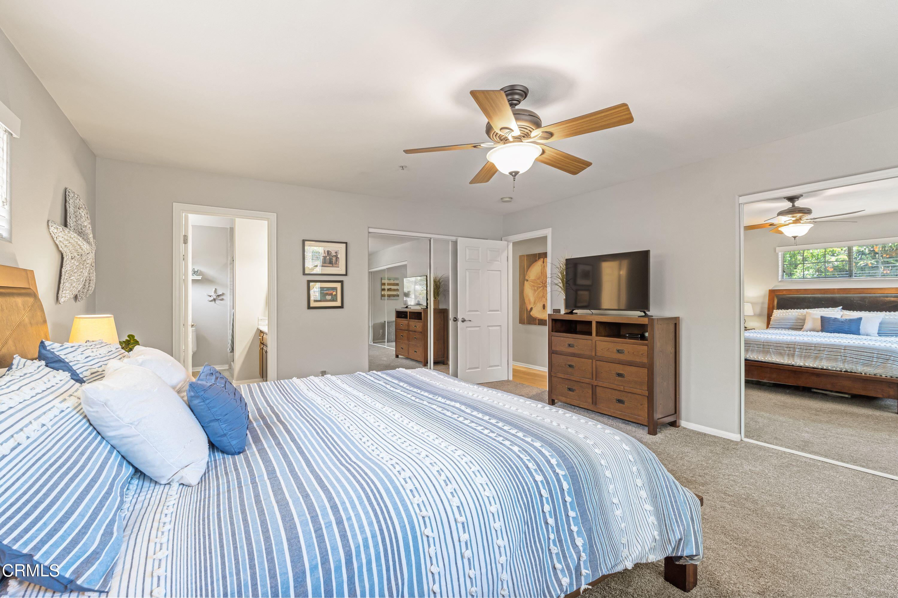 10975 Darling Road Ventura, CA 93004 - Photo 20 of 49 a bedroom with a bed and a flat screen tv